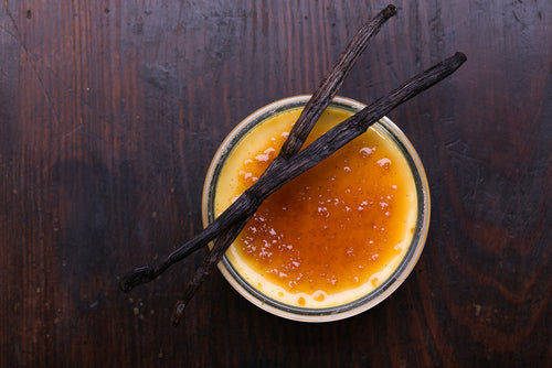 Burnt sugar topping on a dessert with vanilla beans