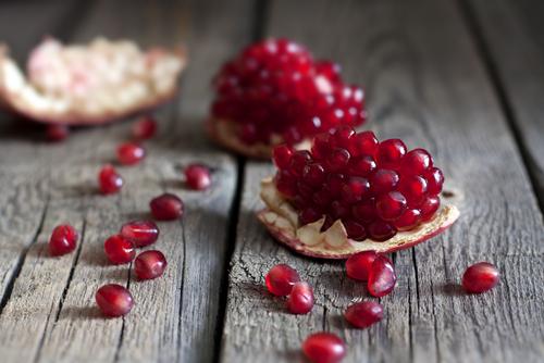 Pomegranate arils on table